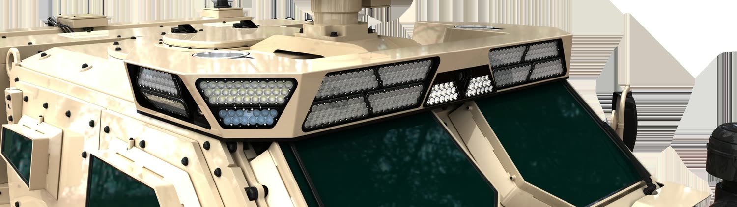 Aveo roof-mounted lighting array on a tan armored vehicle