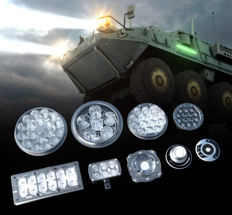 The MadMaxx lighting family in front of an armored vehicle