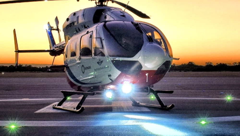 Aveo Sapphire searchlight on an air-ambulance helicopter at dusk