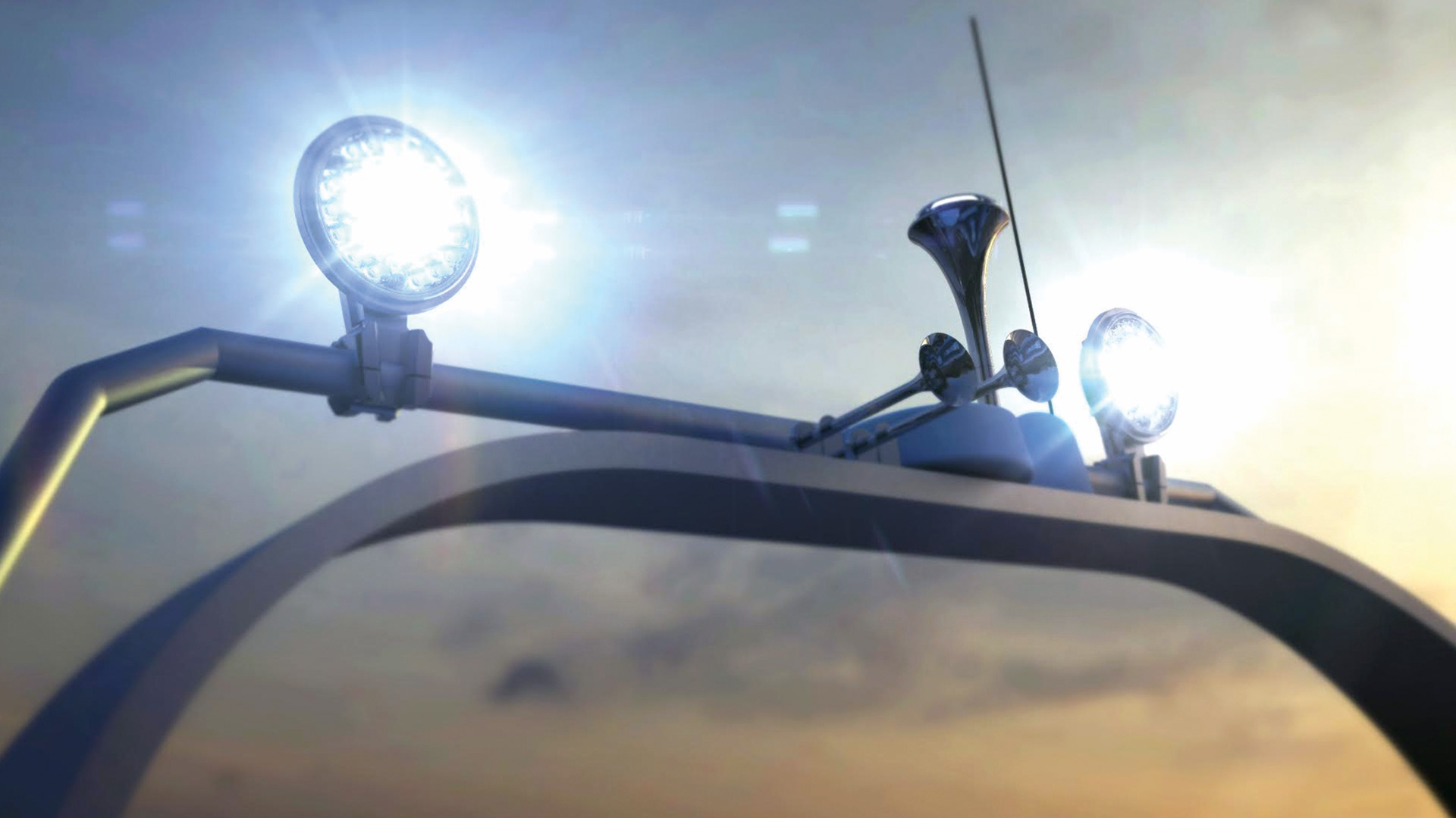 Twin AveoShark searchlights on a boat arch at dusk