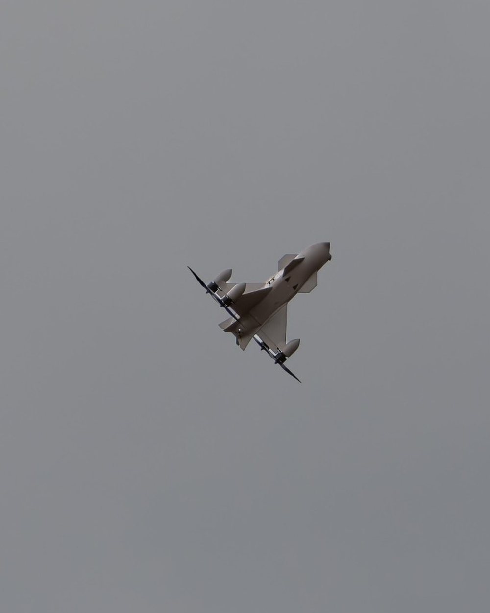 Aveo ConeHead interceptor banking against an overcast sky