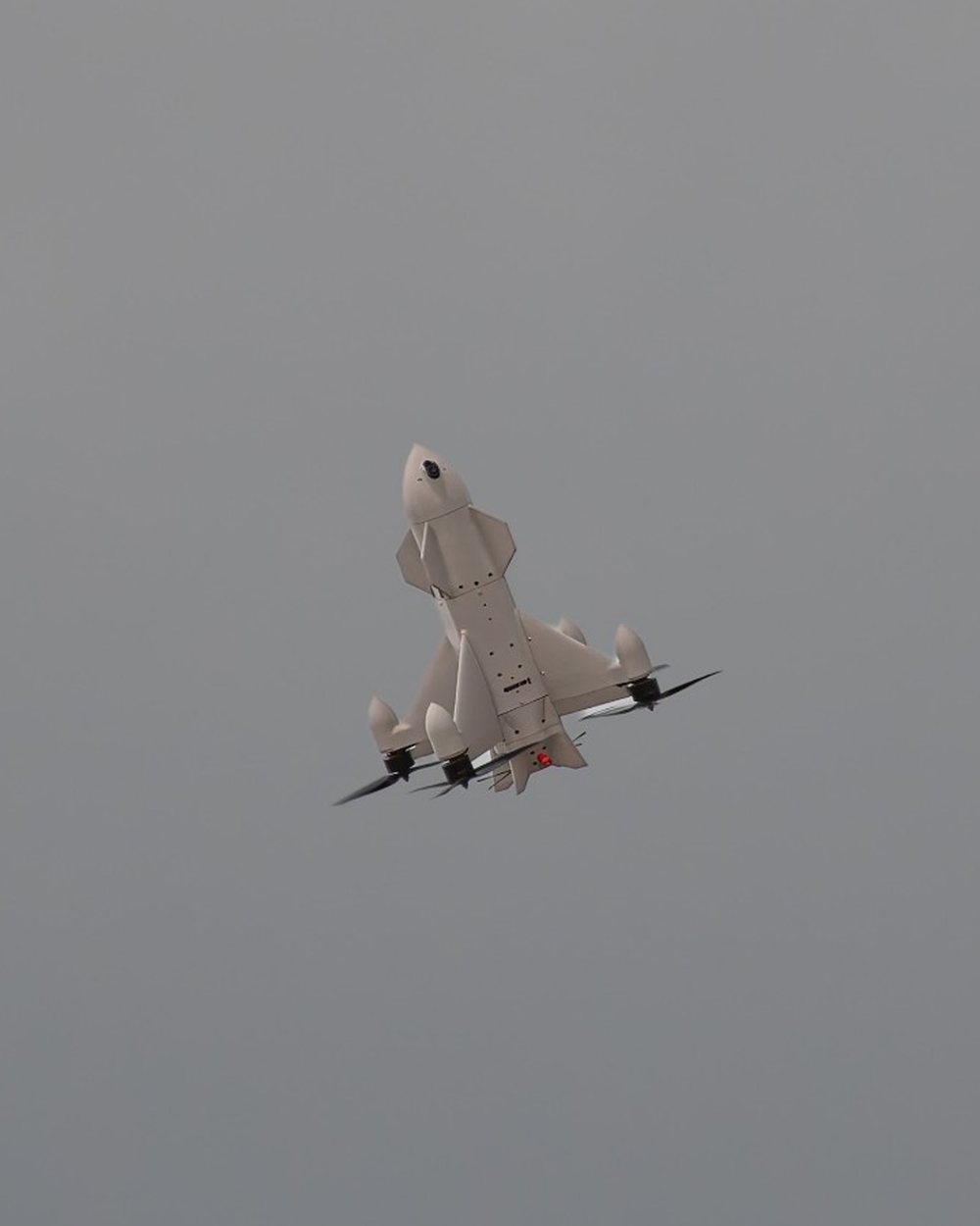 Aveo ConeHead interceptor climbing, overcast sky