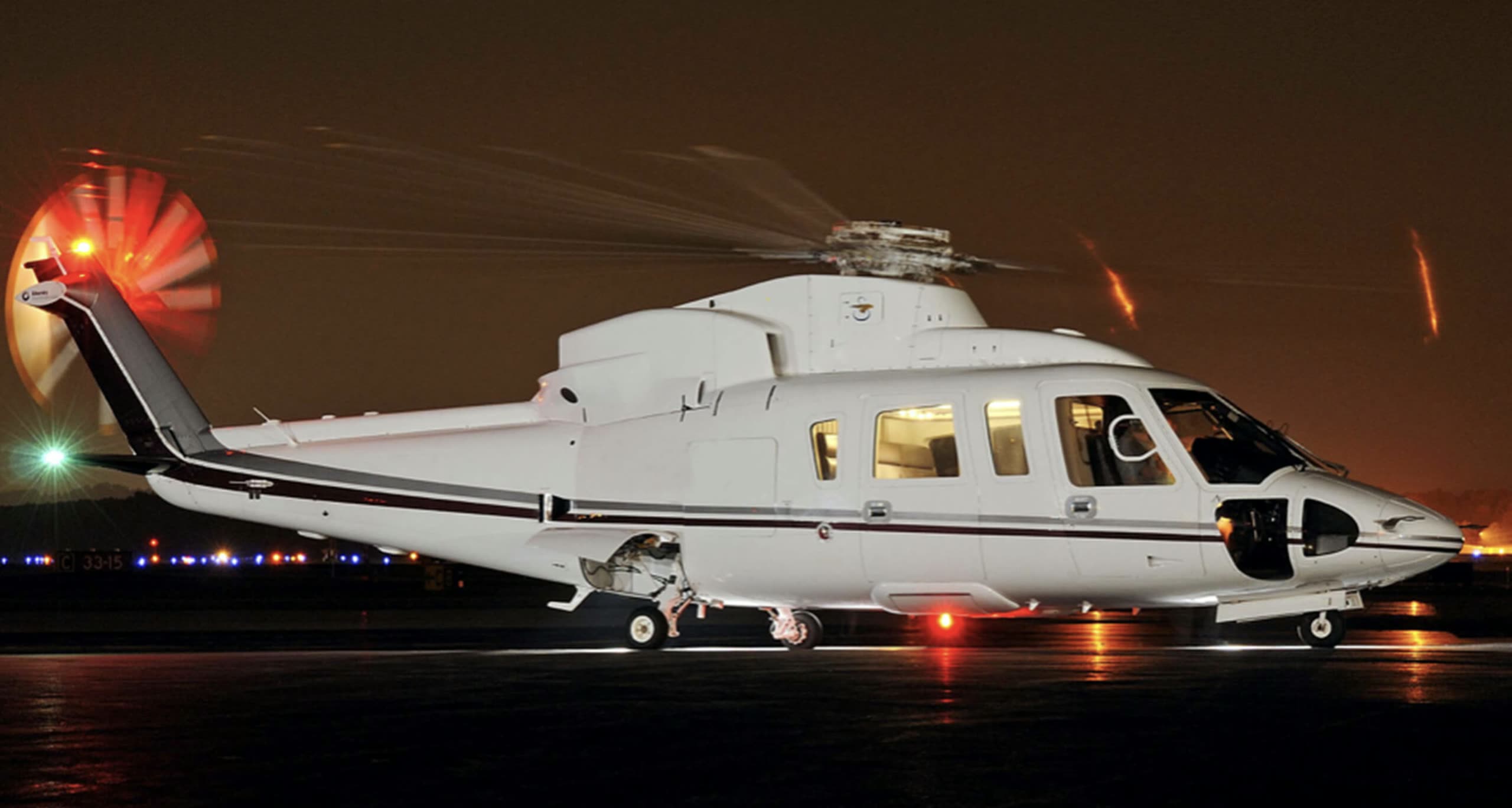 S-76 on the ramp at night, anti-collision lit